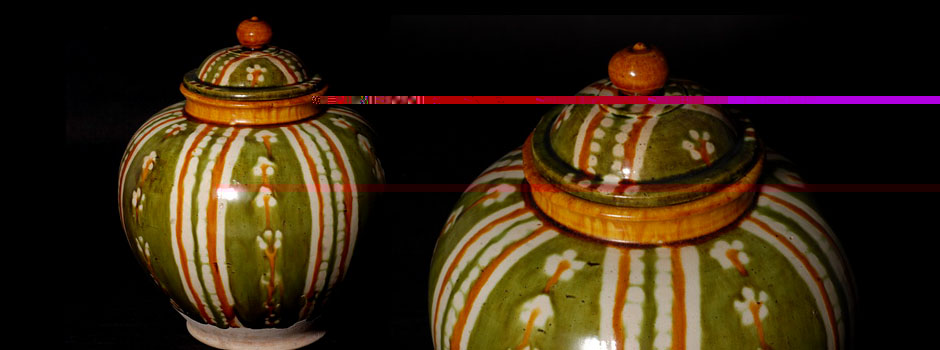 Covered jar of the Tang Dynasty with tricolored strip patterns